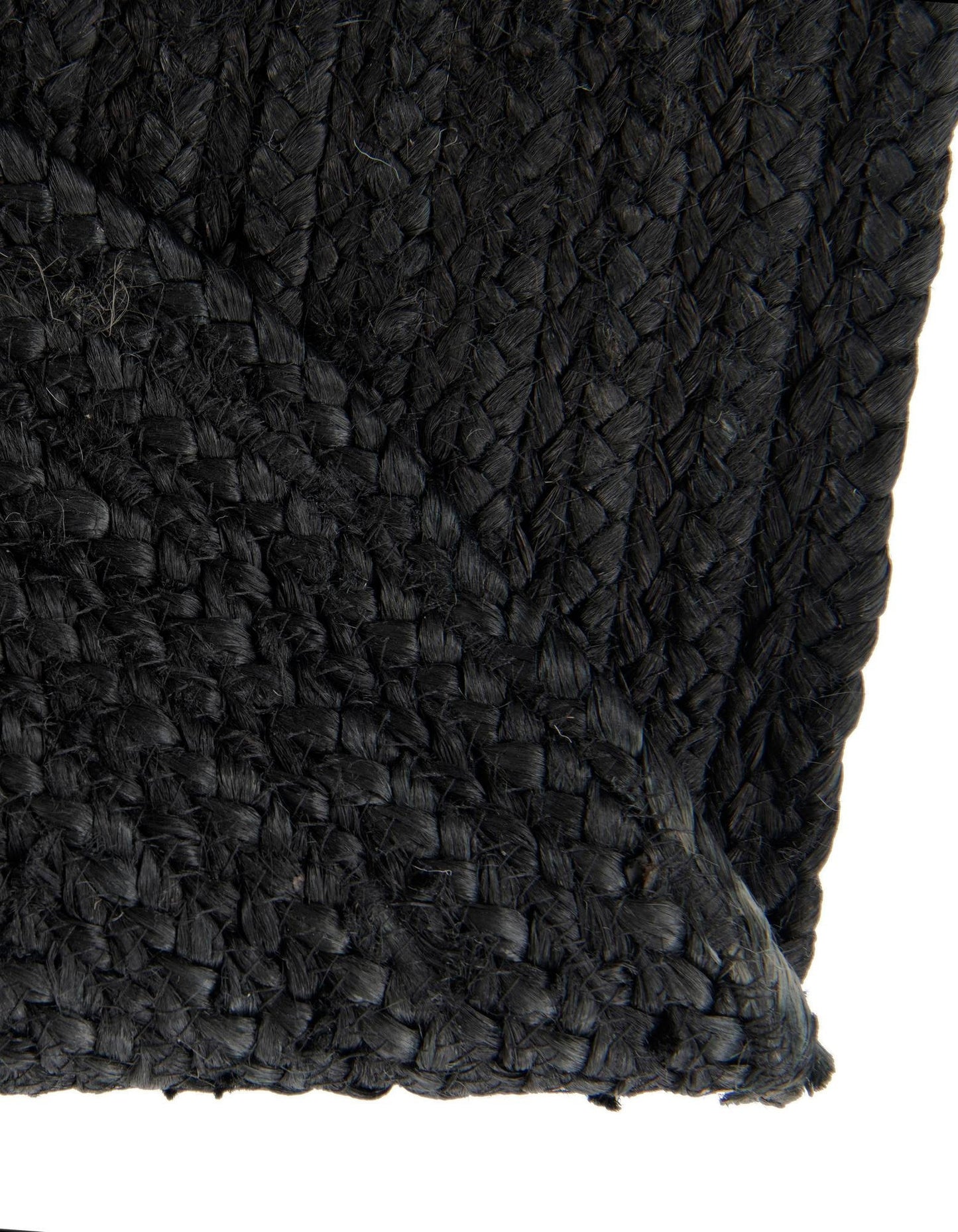 Close-up of a textured black fabric with a diamond pattern