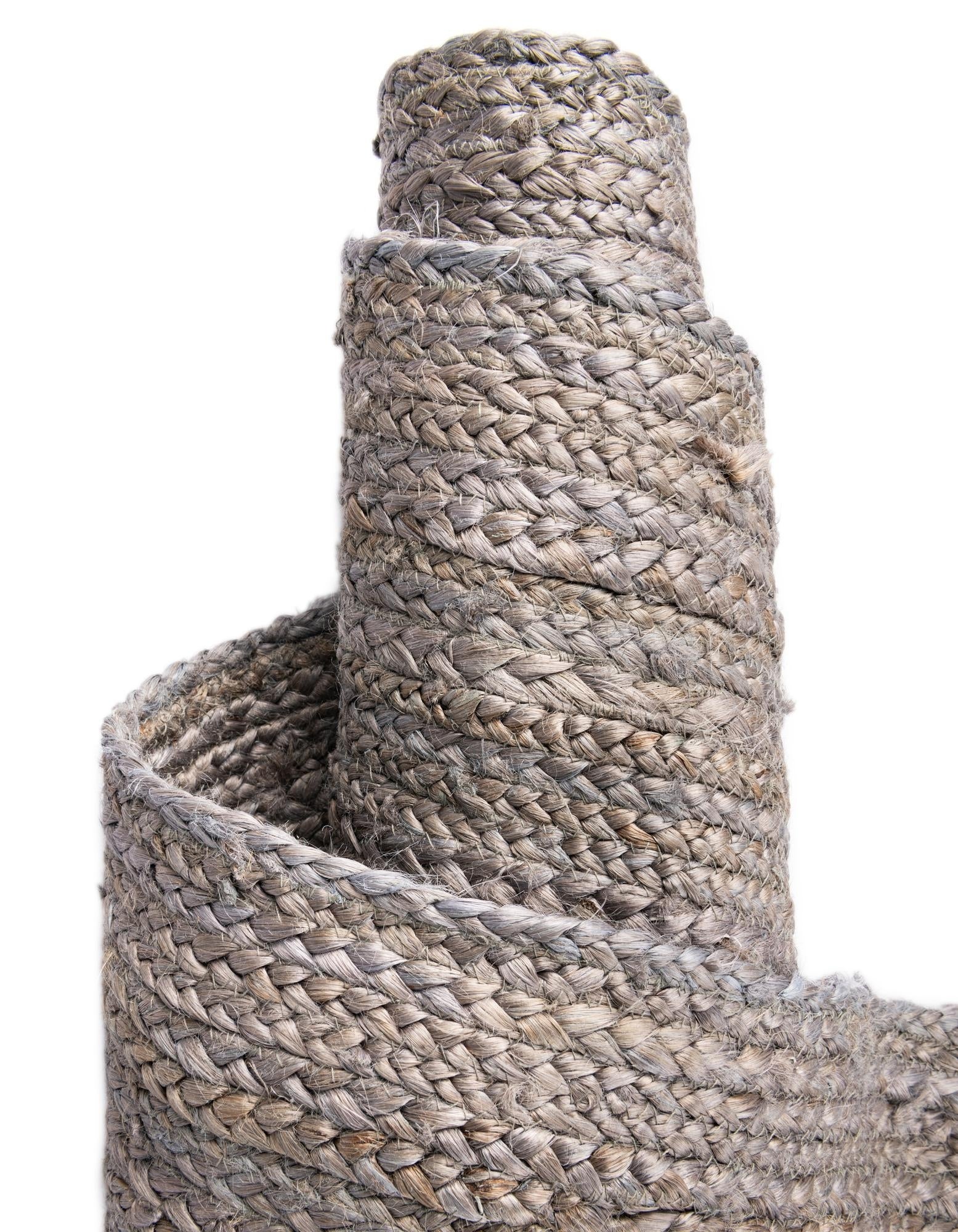 Close-up of a textured woven mat on a white background