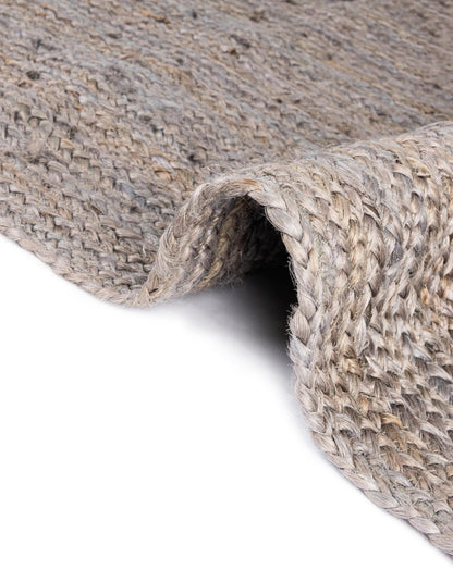 Close-up of a textured gray rug on a white background