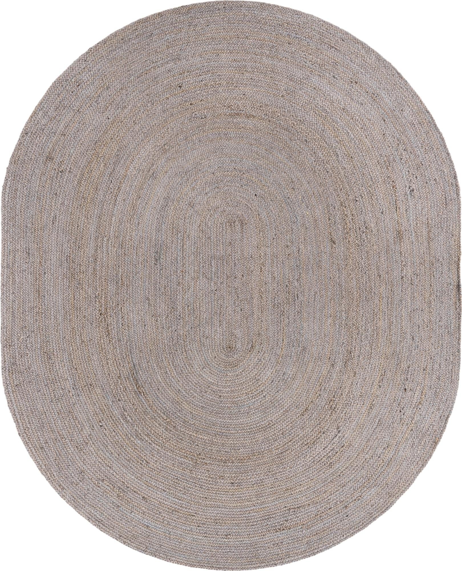 Oval braided rug with a textured pattern on a white background