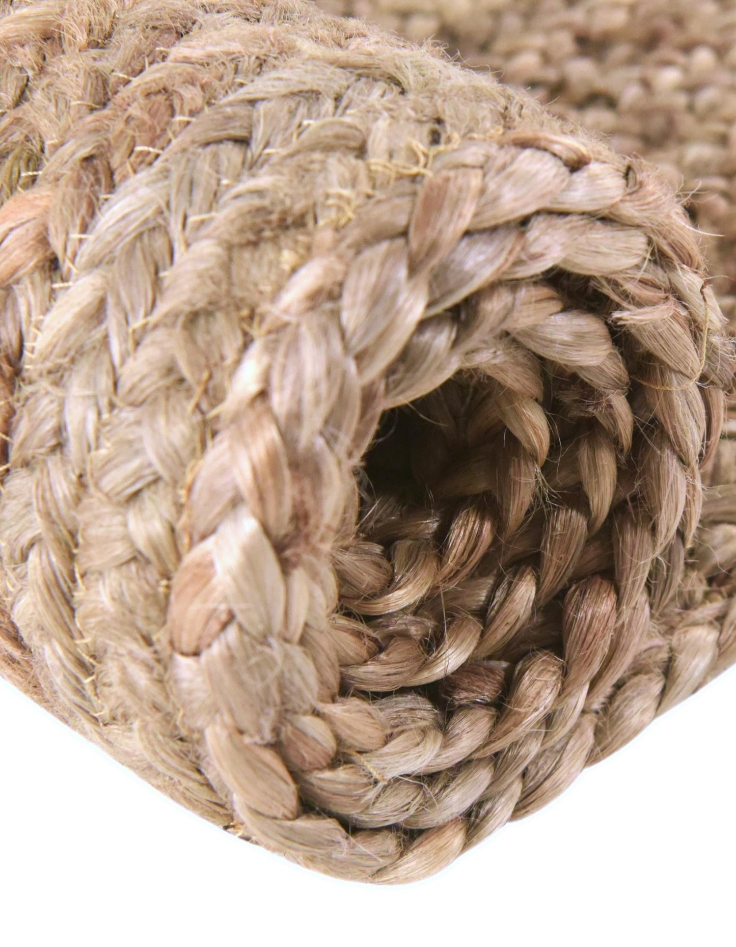 Close-up of a braided rope with a neutral color palette.