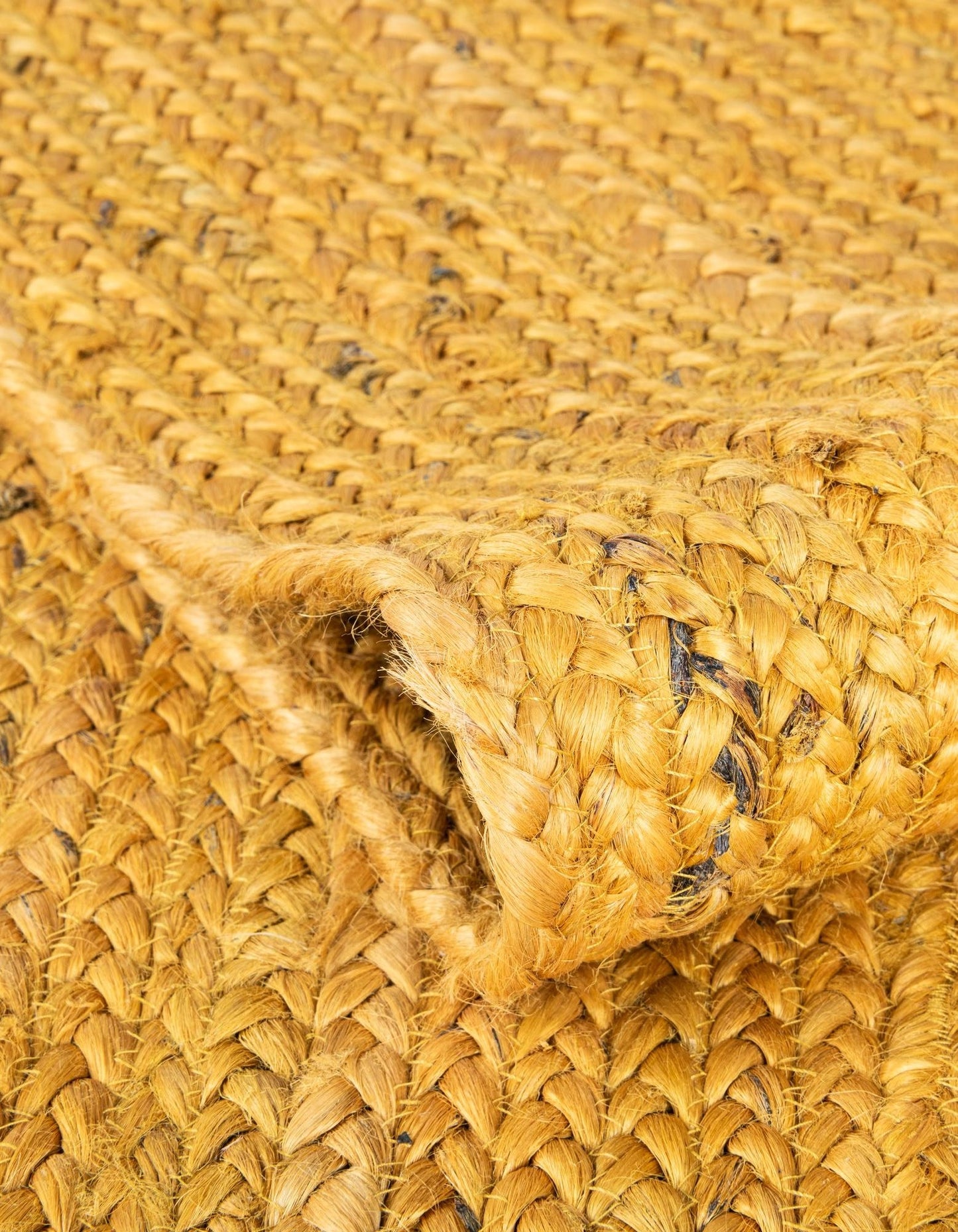 Close-up of a woven straw surface with visible texture and pattern.