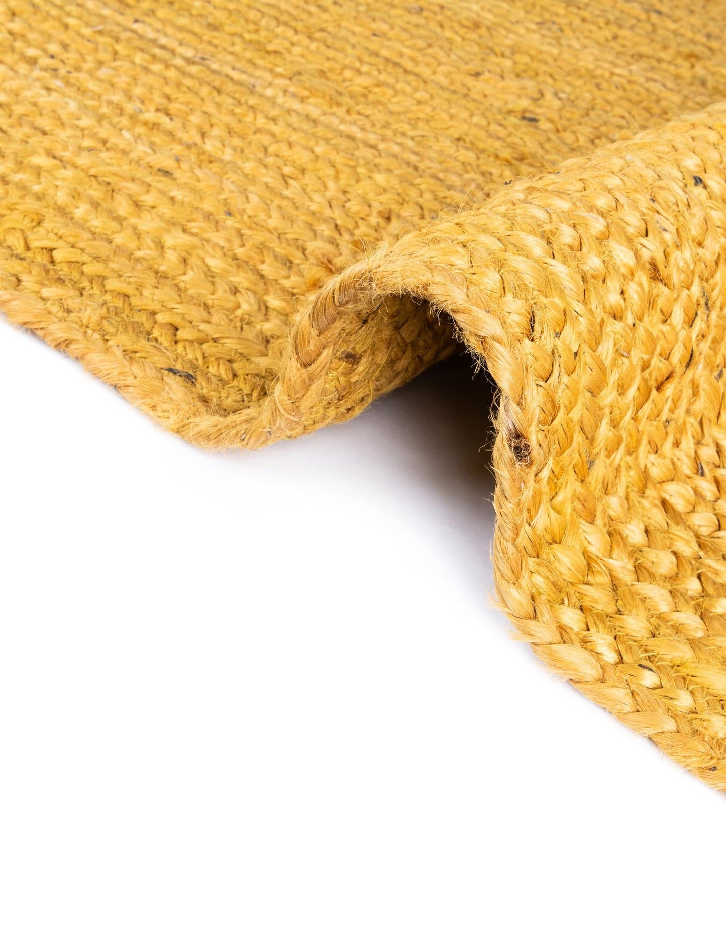 Close-up of a textured yellow woven mat on a white background