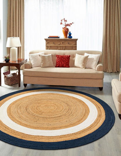 Living room with a round jute rug, beige sofa, and decorative items.