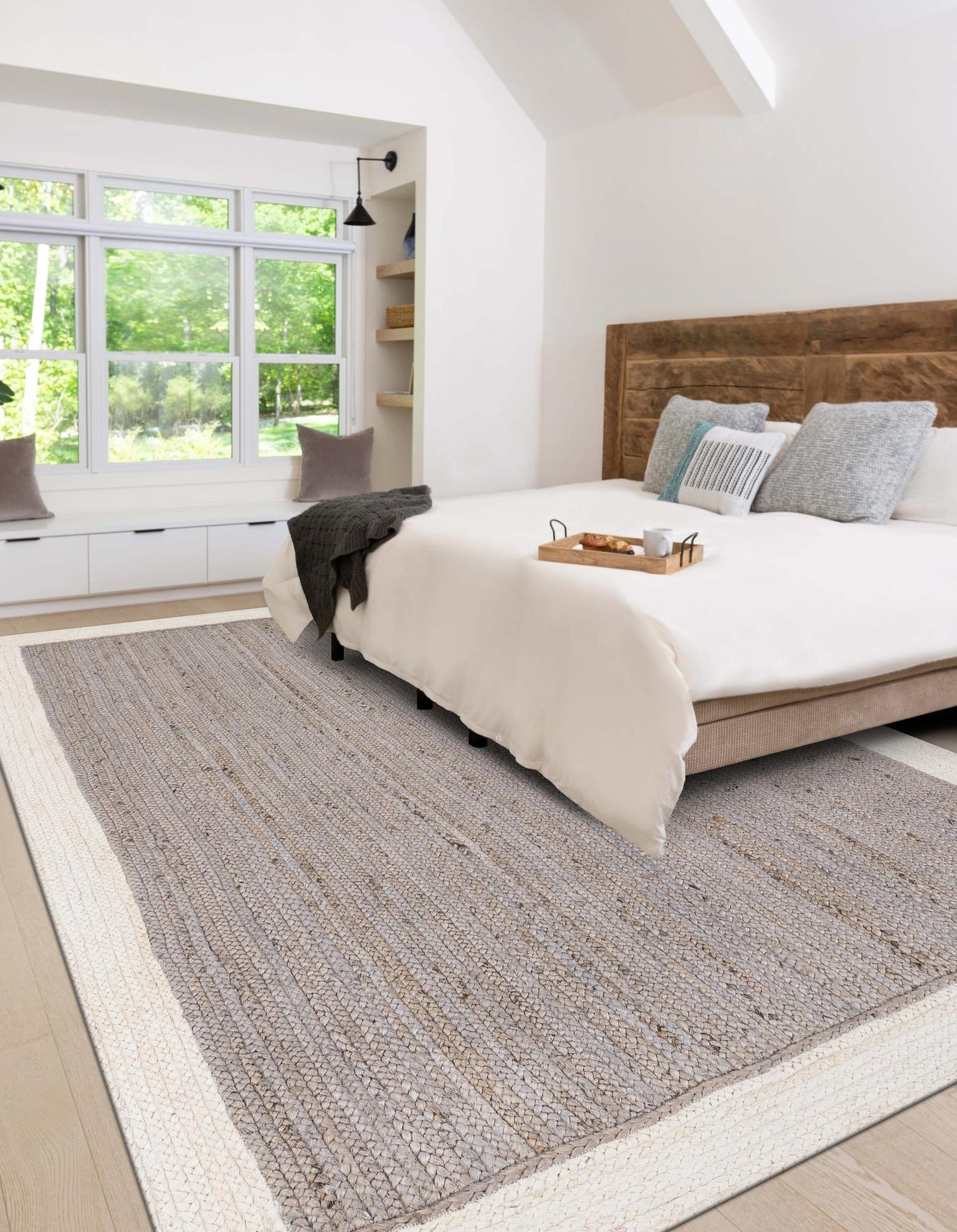 Bedroom with a large bed, wooden headboard, and a rug on the floor.