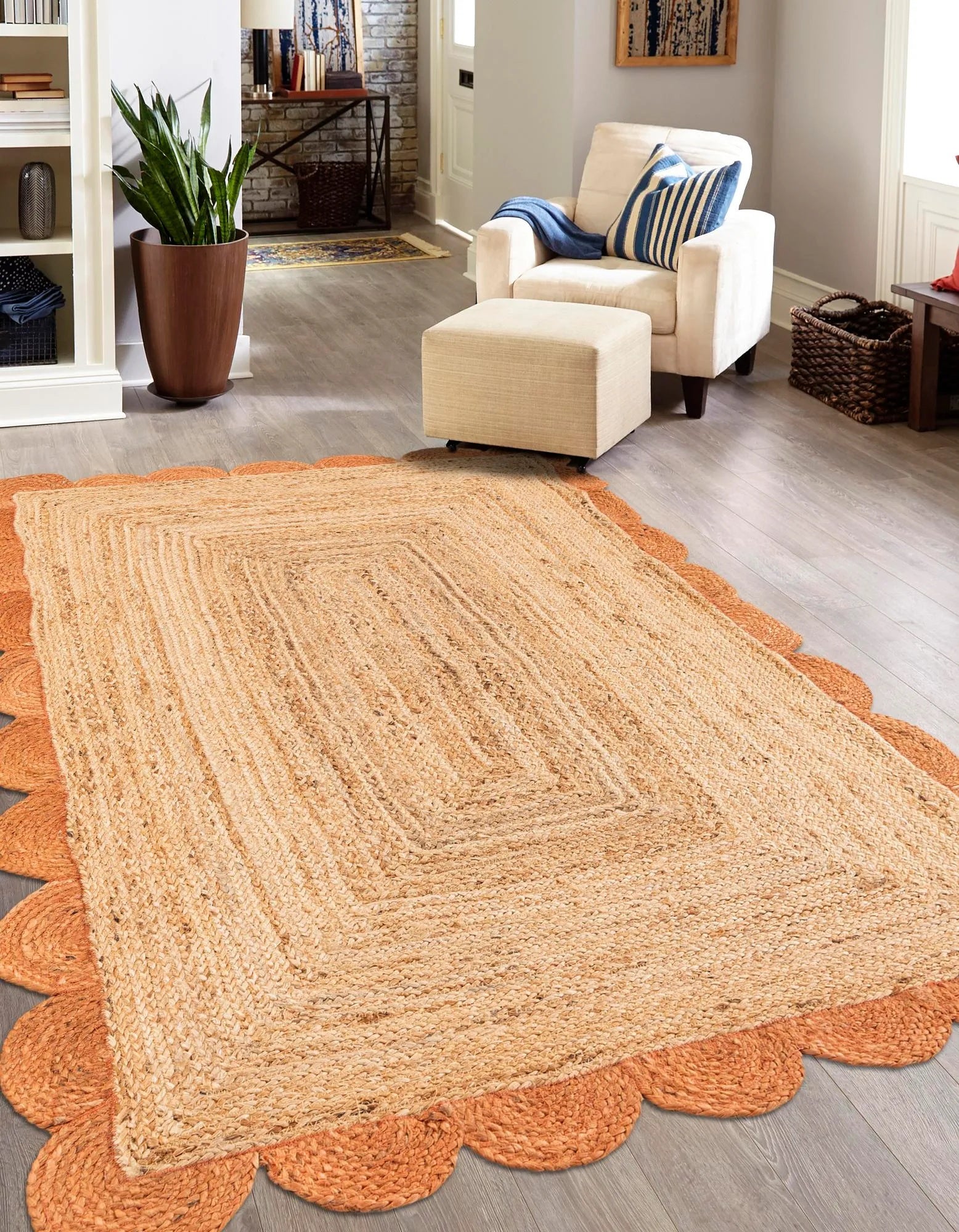 Rectangular handwoven natural jute area rug with burnt orange scalloped border, perfect for farmhouse boho décor in living room, bedroom, hallway, and dining space