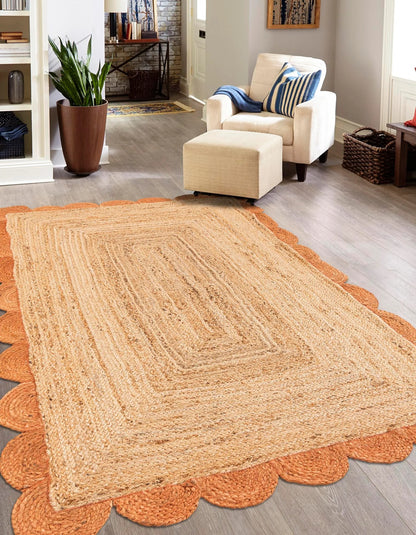 Rectangular handwoven natural jute area rug with burnt orange scalloped border, perfect for farmhouse boho décor in living room, bedroom, hallway, and dining space