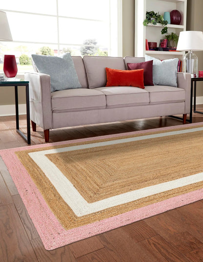 Rectangular natural jute area rug with pink and white border, handwoven farmhouse boho floor rug for living room, bedroom, and cozy home décor