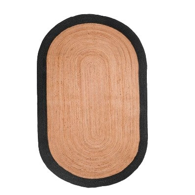Oval-shaped rug with black border on a white background