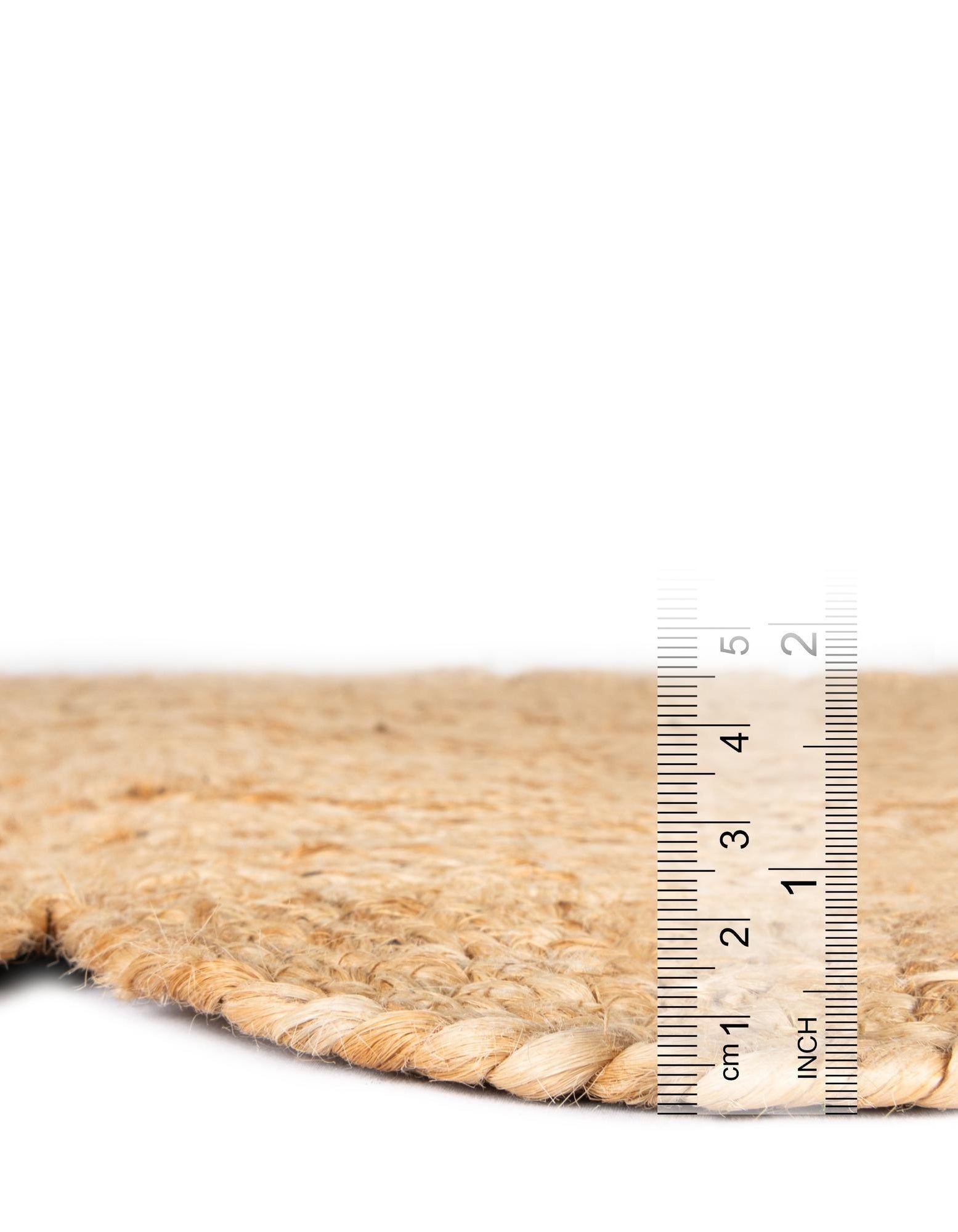 Rug with a ruler for scale on a white background
