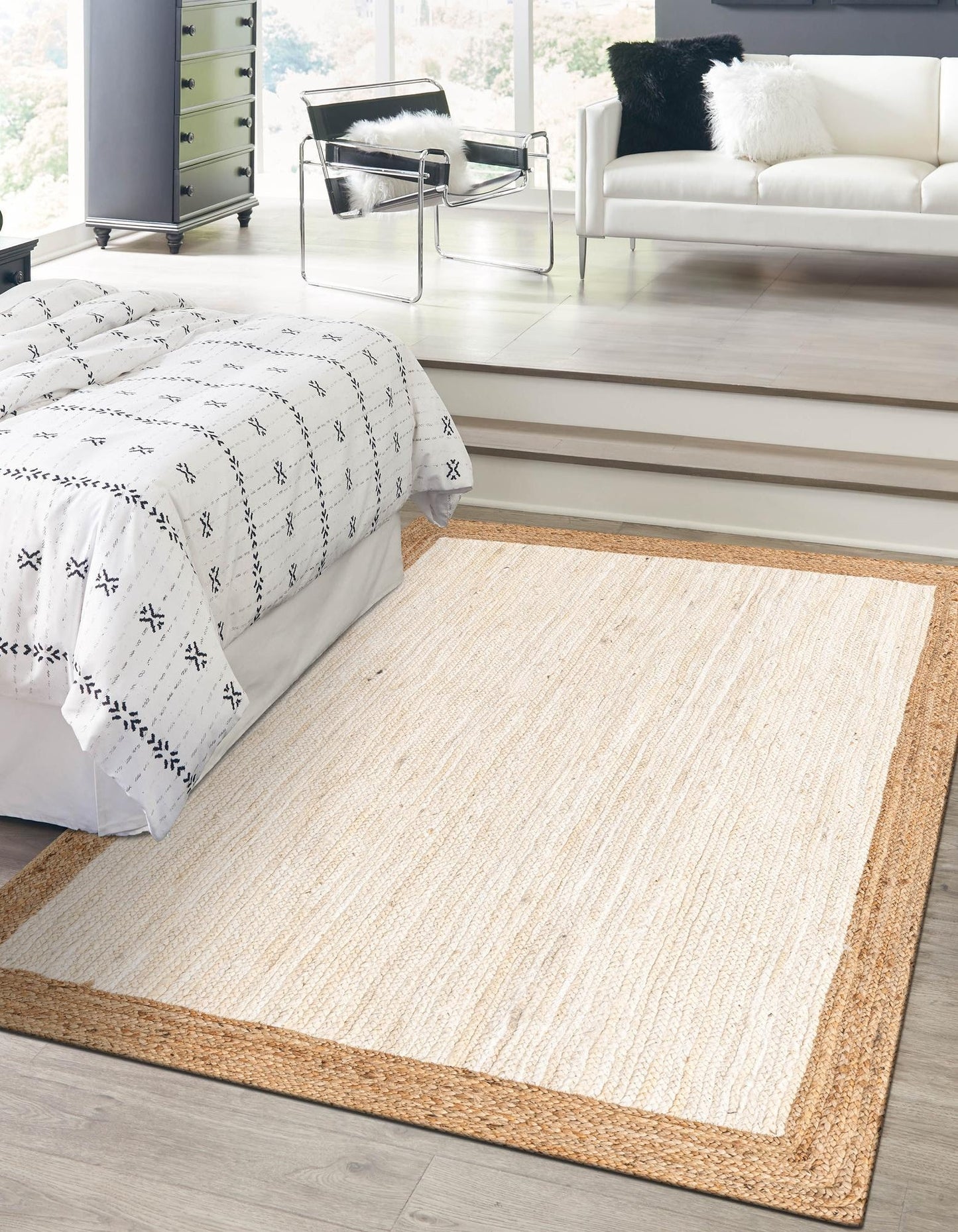 Beige area rug in a modern living room with a bed and sofa.