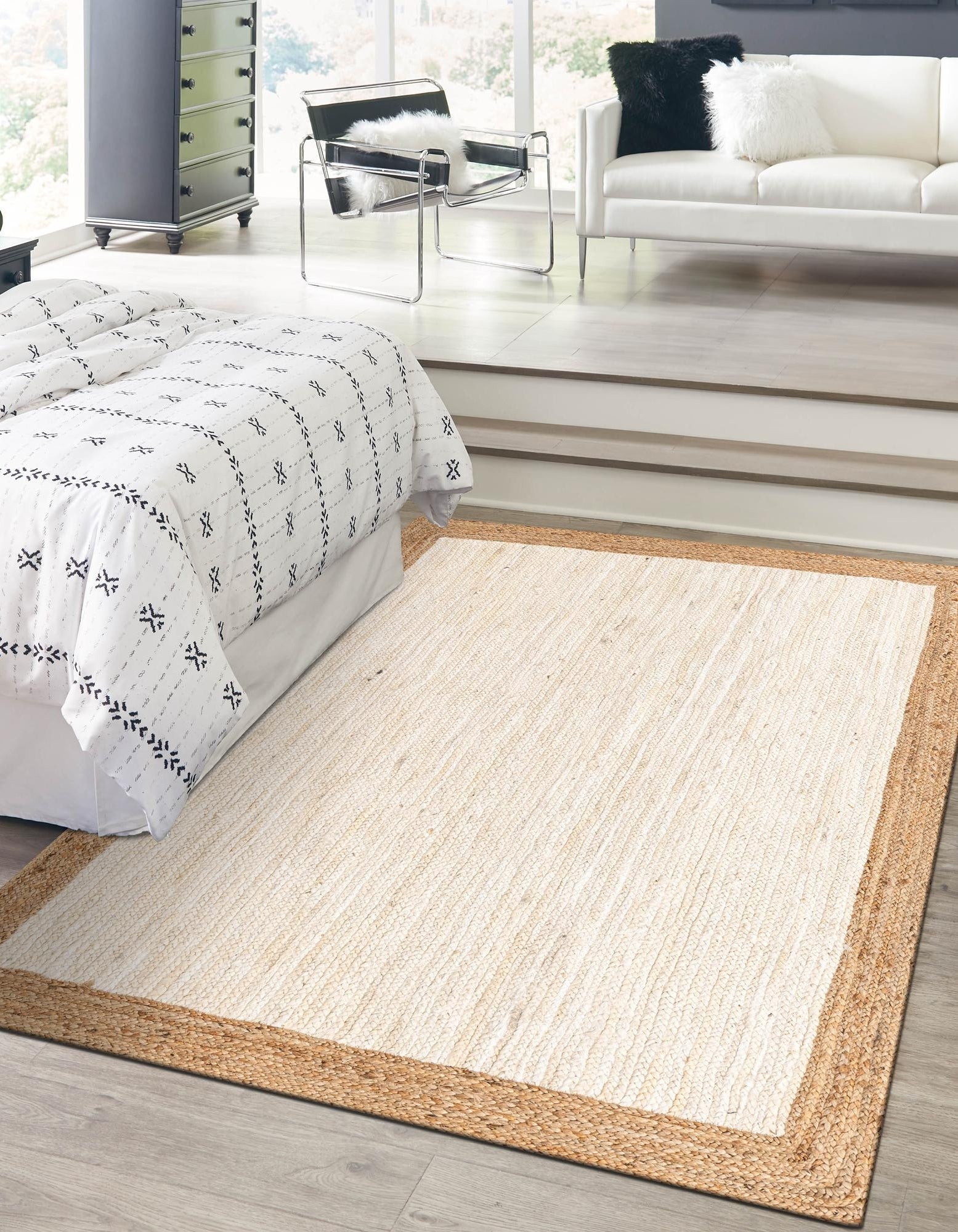 Beige area rug in a modern living room with a bed and sofa.
