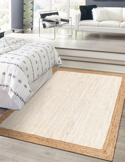 Beige area rug in a modern living room with a bed and sofa.