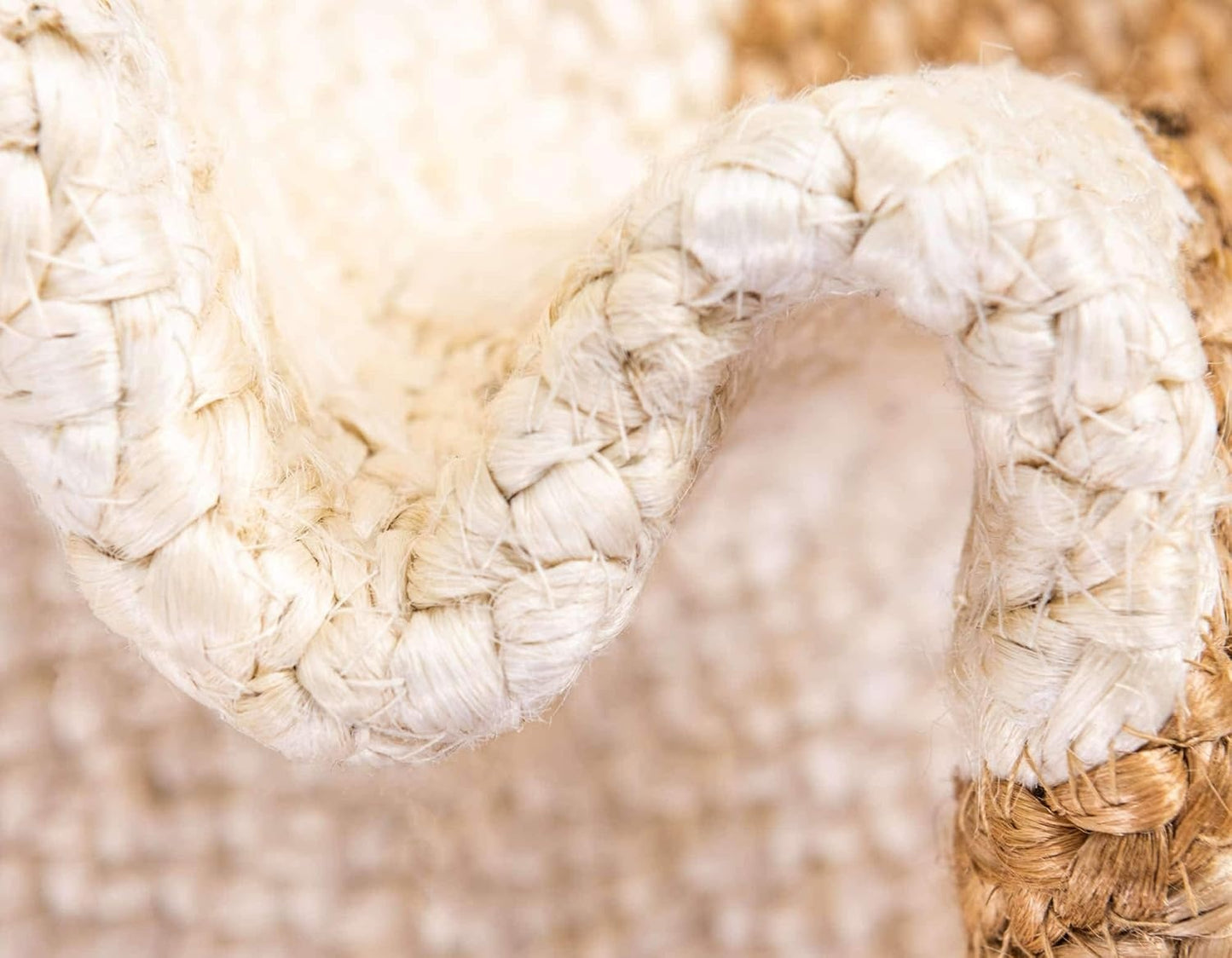 Close-up of a woven white chair with a blurred natural background