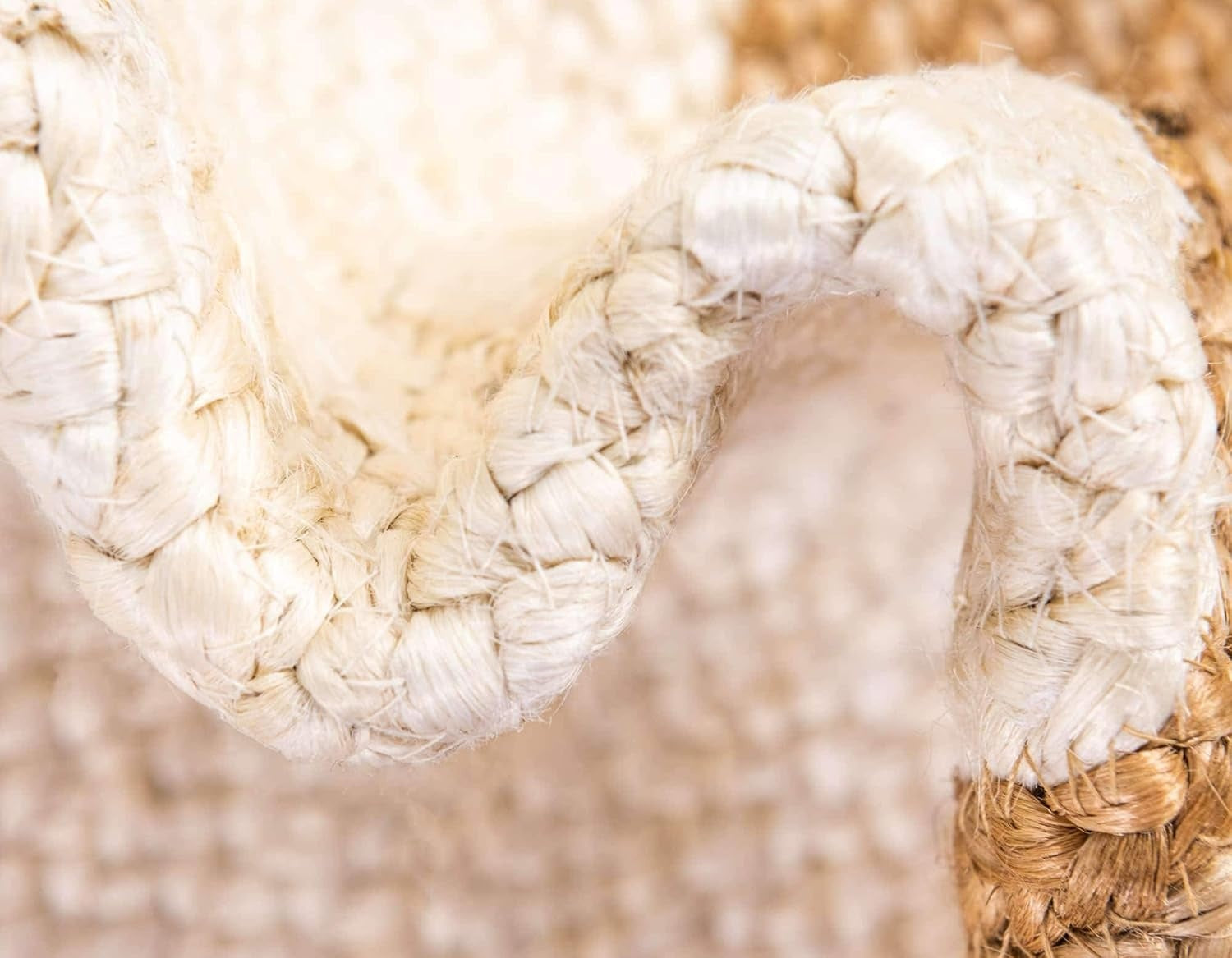 Close-up of a woven white chair with a blurred natural background