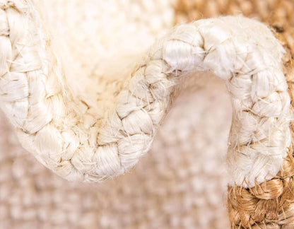 Close-up of a woven white chair with a blurred natural background
