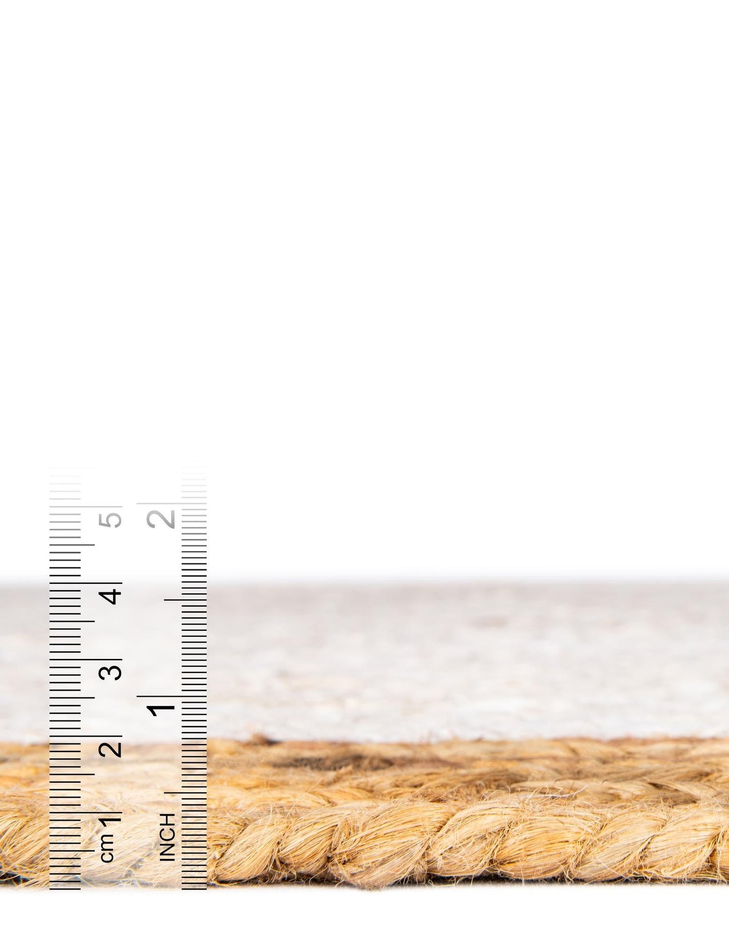 Rope with a ruler for scale on a white background