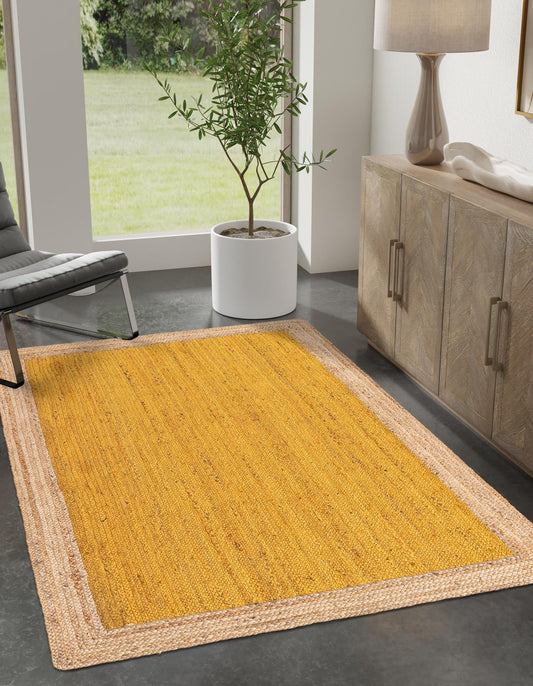 Yellow braided rug in a room with a plant and furniture.