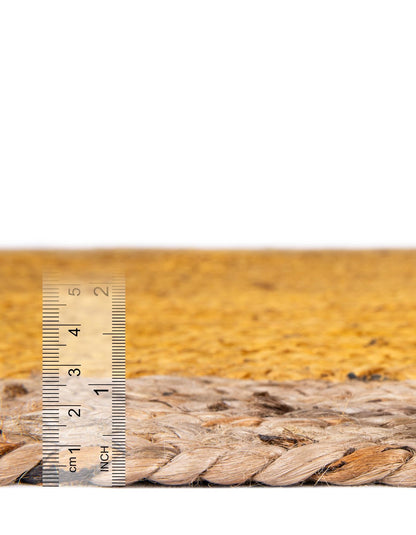 Rope with a ruler for scale on a wooden surface