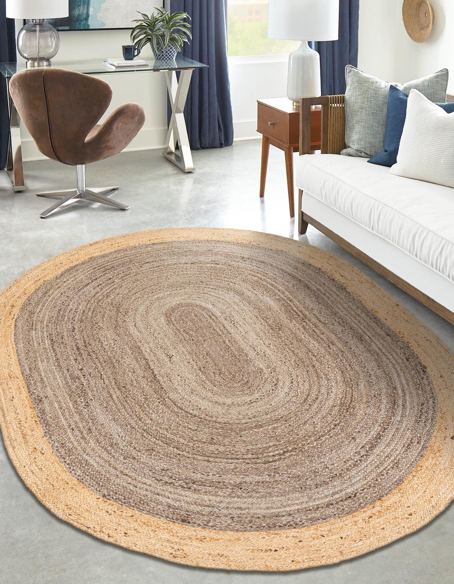 Round braided rug in a living room setting with furniture and decor.