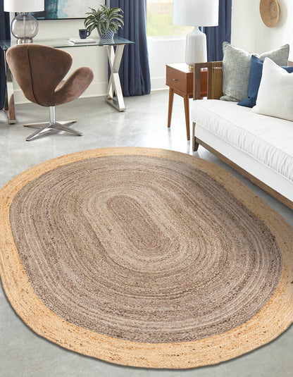 Round braided rug in a living room setting with furniture and decor.