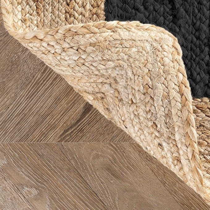Close-up of woven jute rug on wooden floor