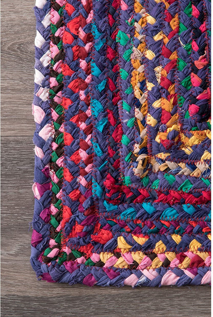 Multicolored braided rug on a wooden floor
