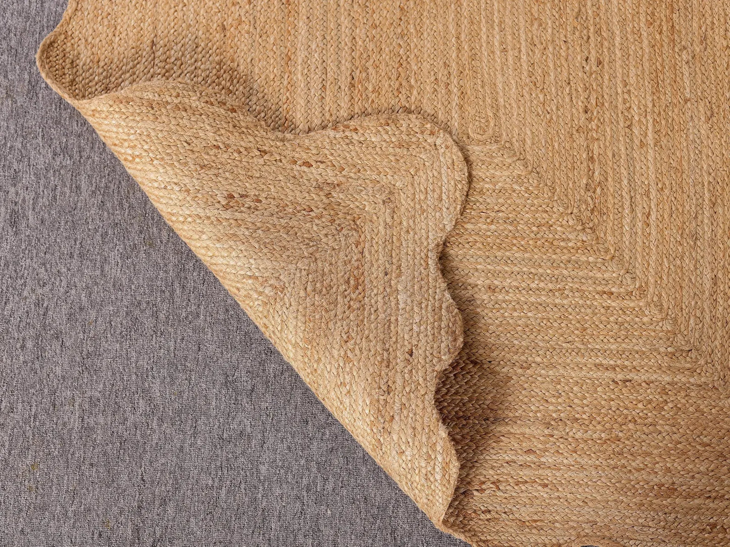 Close-up of a textured brown fabric corner on a gray background