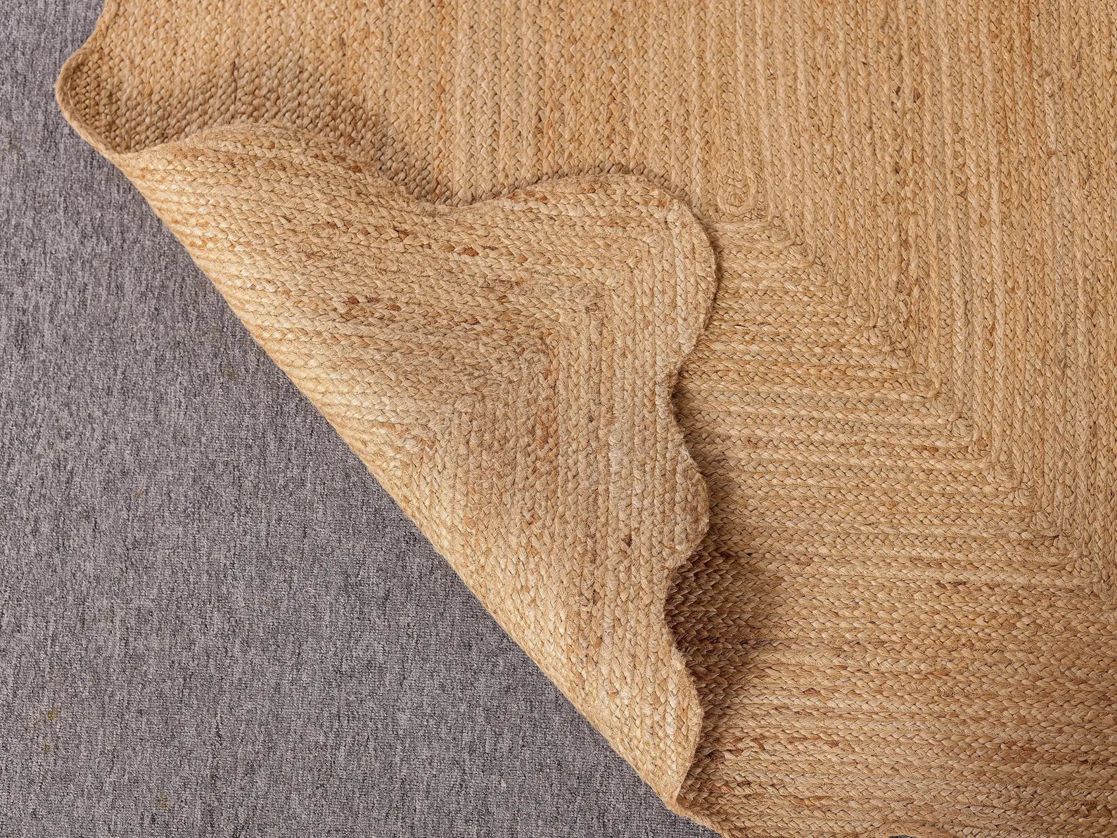 Close-up of a textured brown fabric corner on a gray background