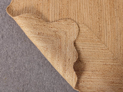 Close-up of a textured brown fabric corner on a gray background